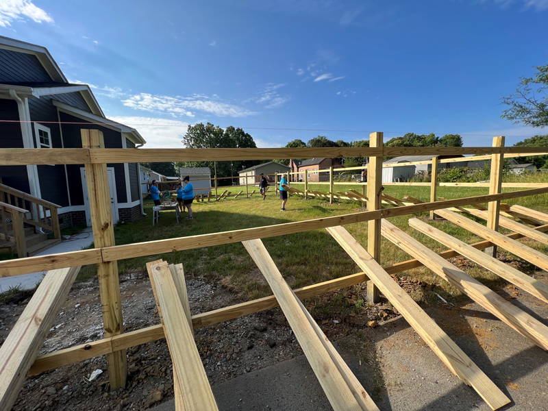 Construction of fence being built by F&M Bank teammates 