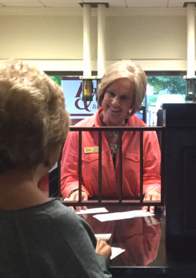 Becky Widenhouse helping a client at a local F&M Bank office 