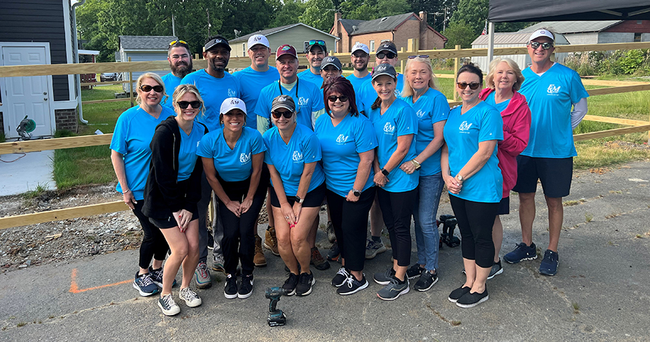 F&M Bank teammates help build a fence for first-time homeowner