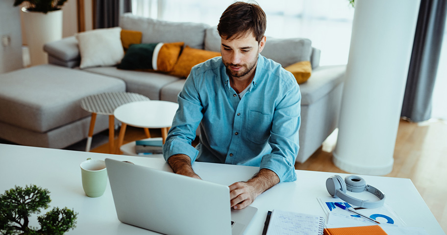Person using a laptop to do their finances.