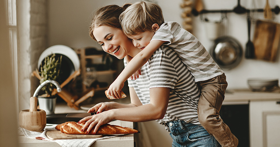 Mother and son preparing food.