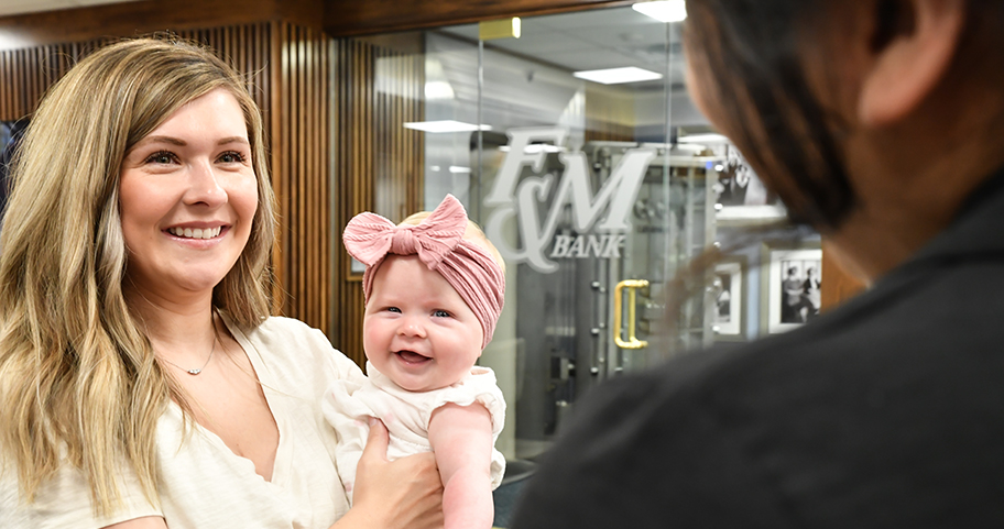 A Mother and daughter at a F&M Bank office