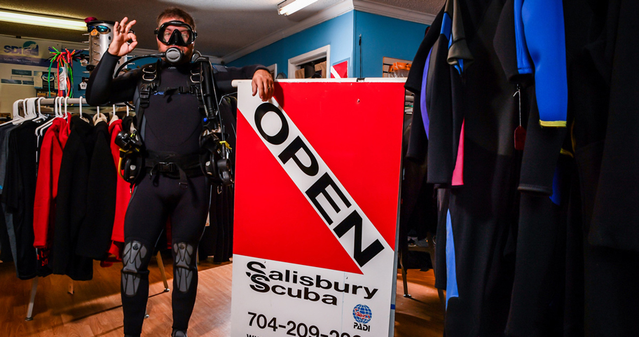 Salisbury Scuba shop owner dressed up in dive gear at the shop 
