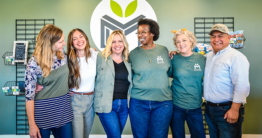 A group of business people smiling.