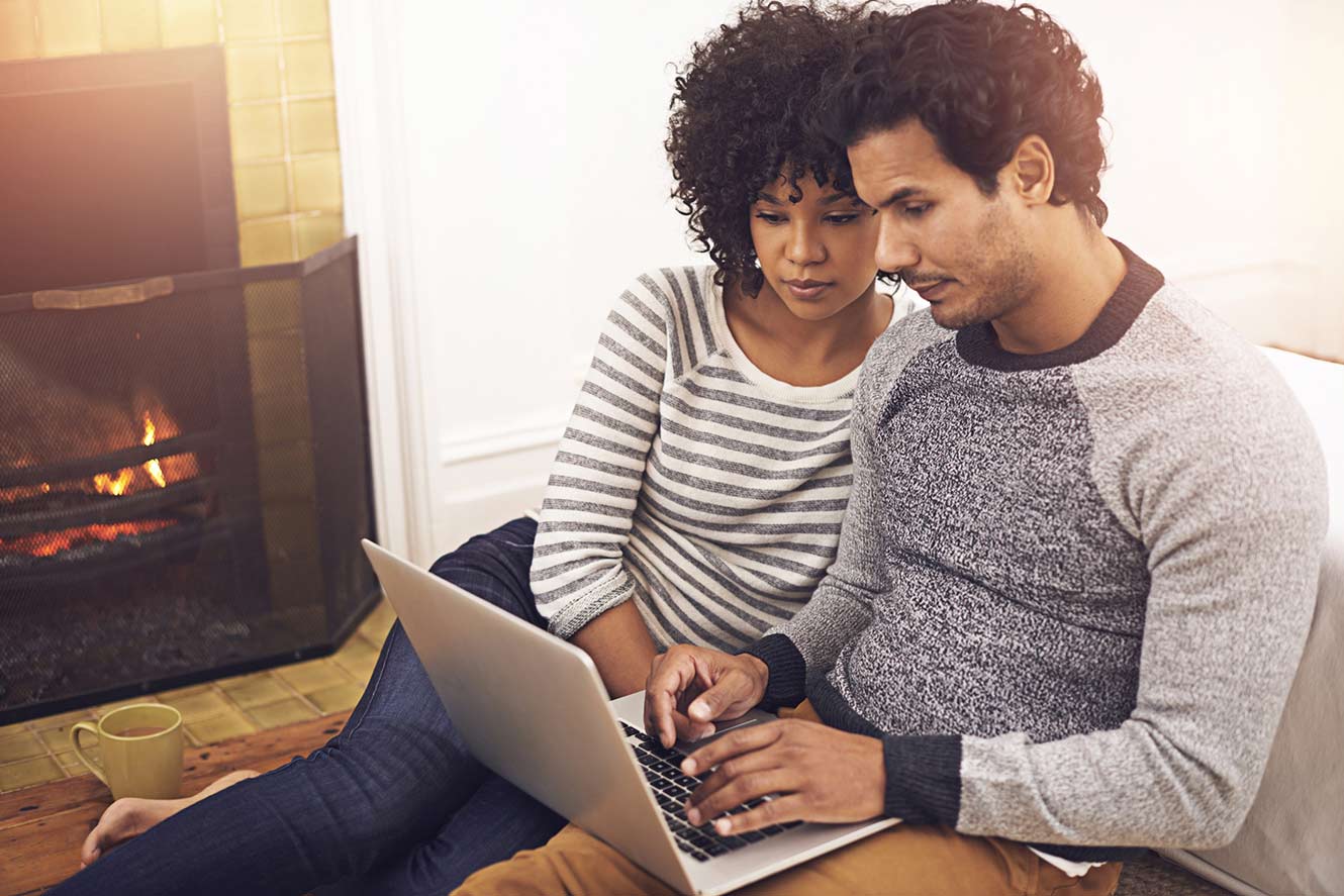 Couple working on laptop together