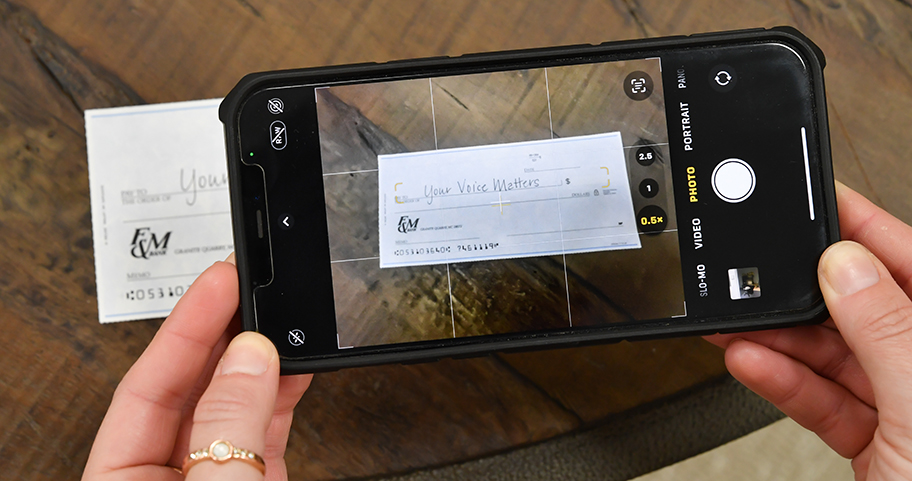 F&M Bank client deposits a check with their smartphone.