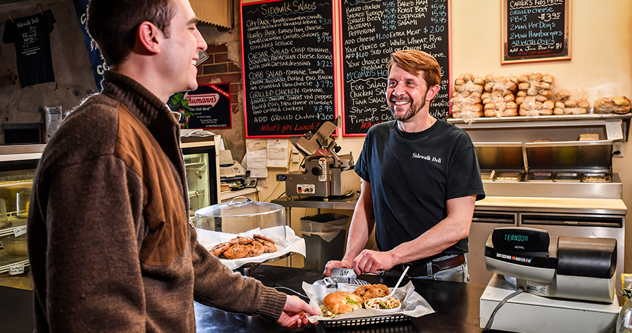 A person purchasing breakfast at a local bakery.