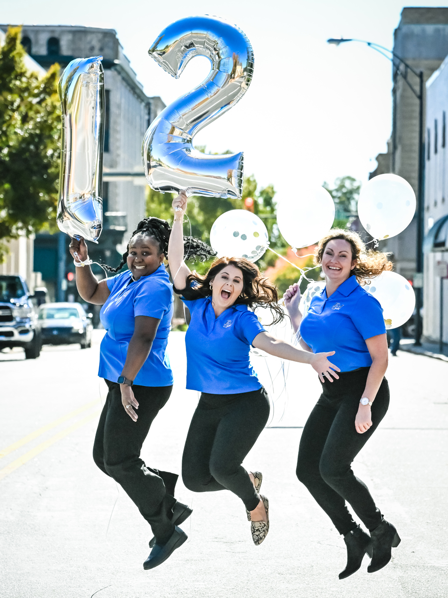 F&M Bank employees having fun celebrating with balloons 